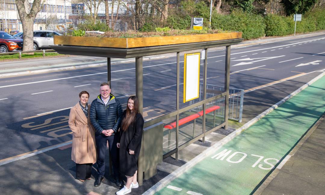 Clear Channel UK's Emma Lloyd and Jennifer Richards standing next to Preston's first Living Roof bus shelter with Lancashire's Councilor Scott Smith