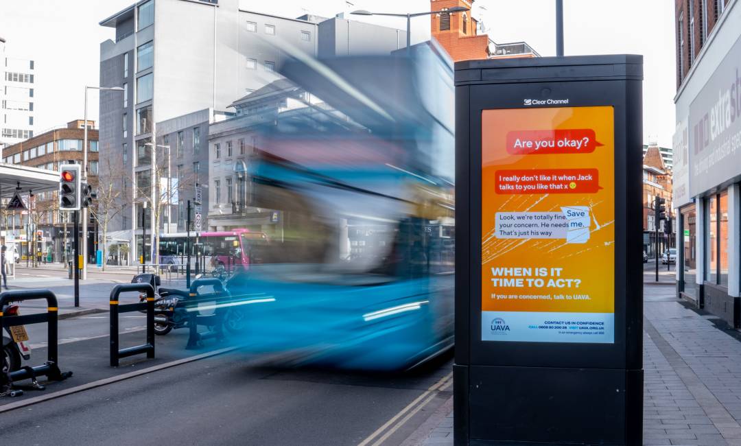 Uava's high street ad with a bus driving past