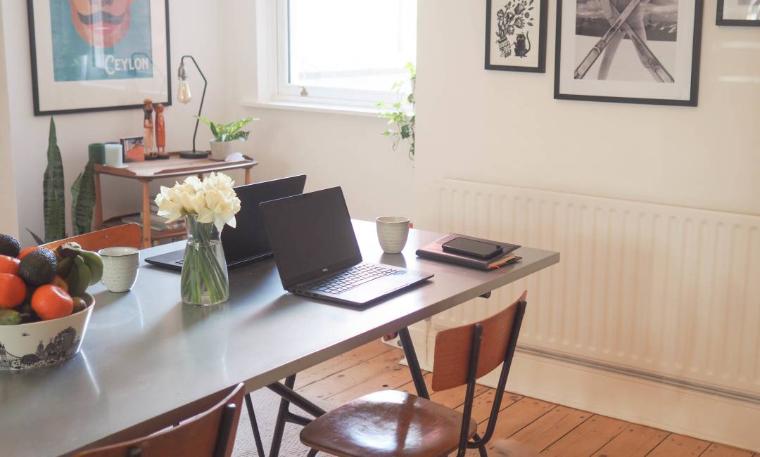 Photo of a laptop on a living room table.