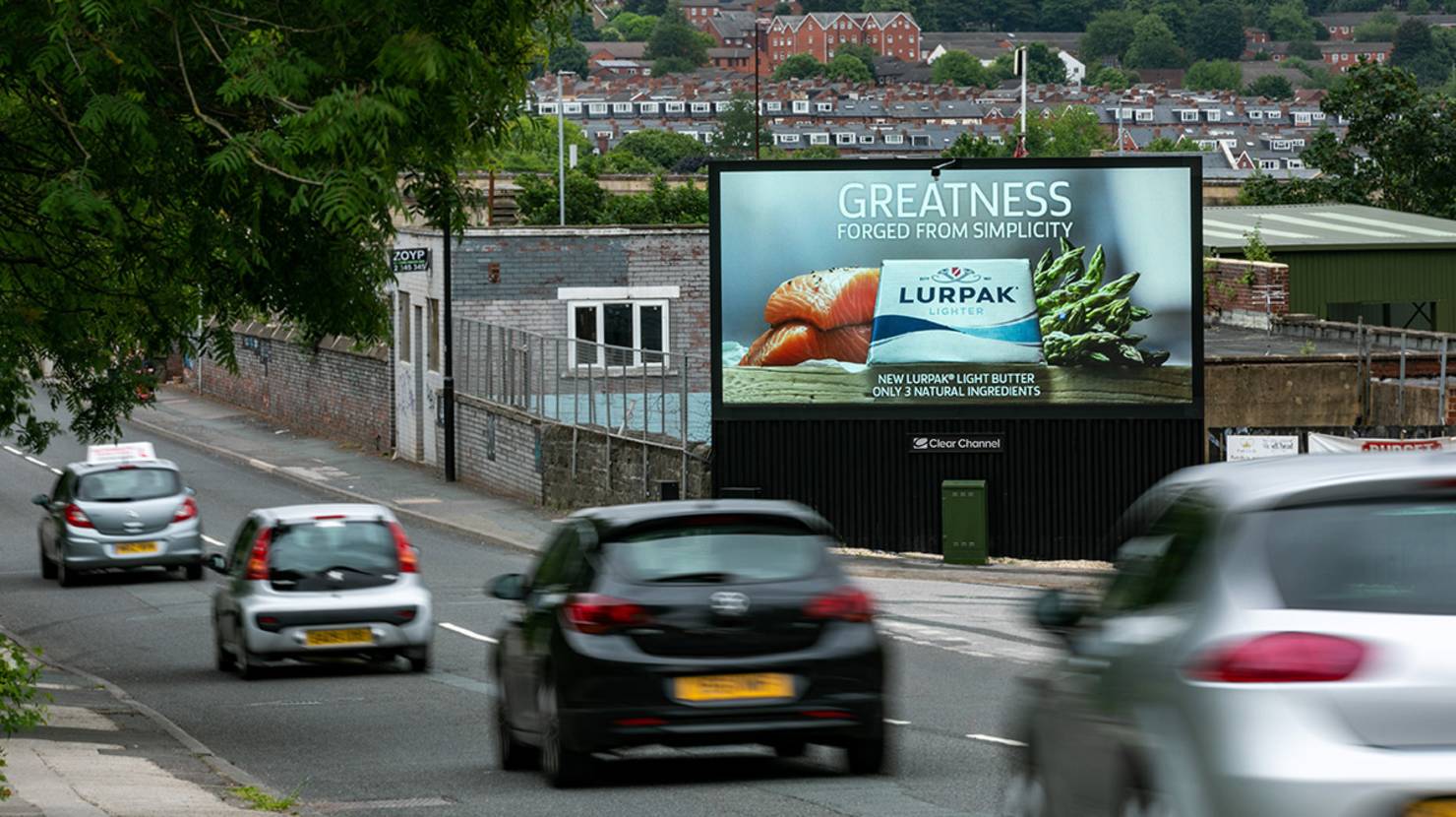 Lurpak digital ad on roadside digital screen with cars passing by