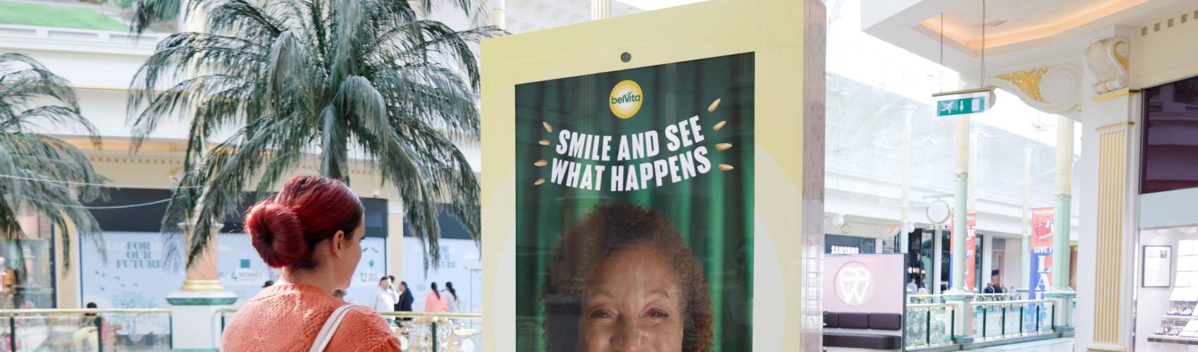 An interactive Belvita advertising screen inside a shopping mall