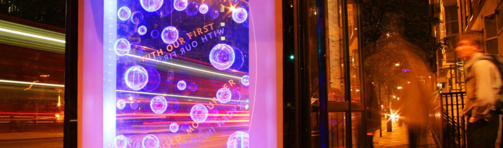 A creative advertising poster displaying bubbles inside of the screen