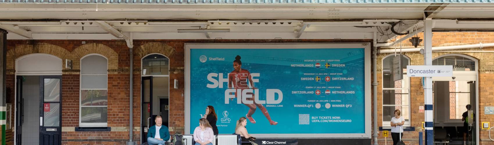 Large billboard on Doncaster station platform showing as for Womens Euros