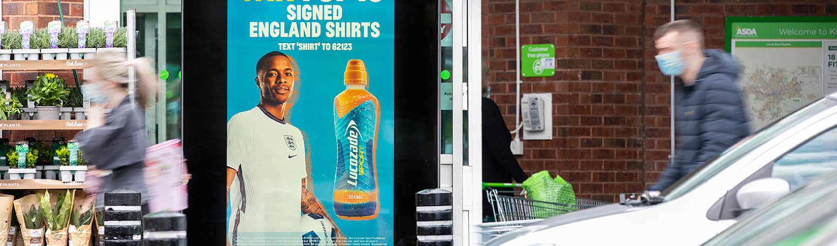 Lucozade ad outside an Asda supermarket supporting the euros football tournament with a competition to win a signed England shirt