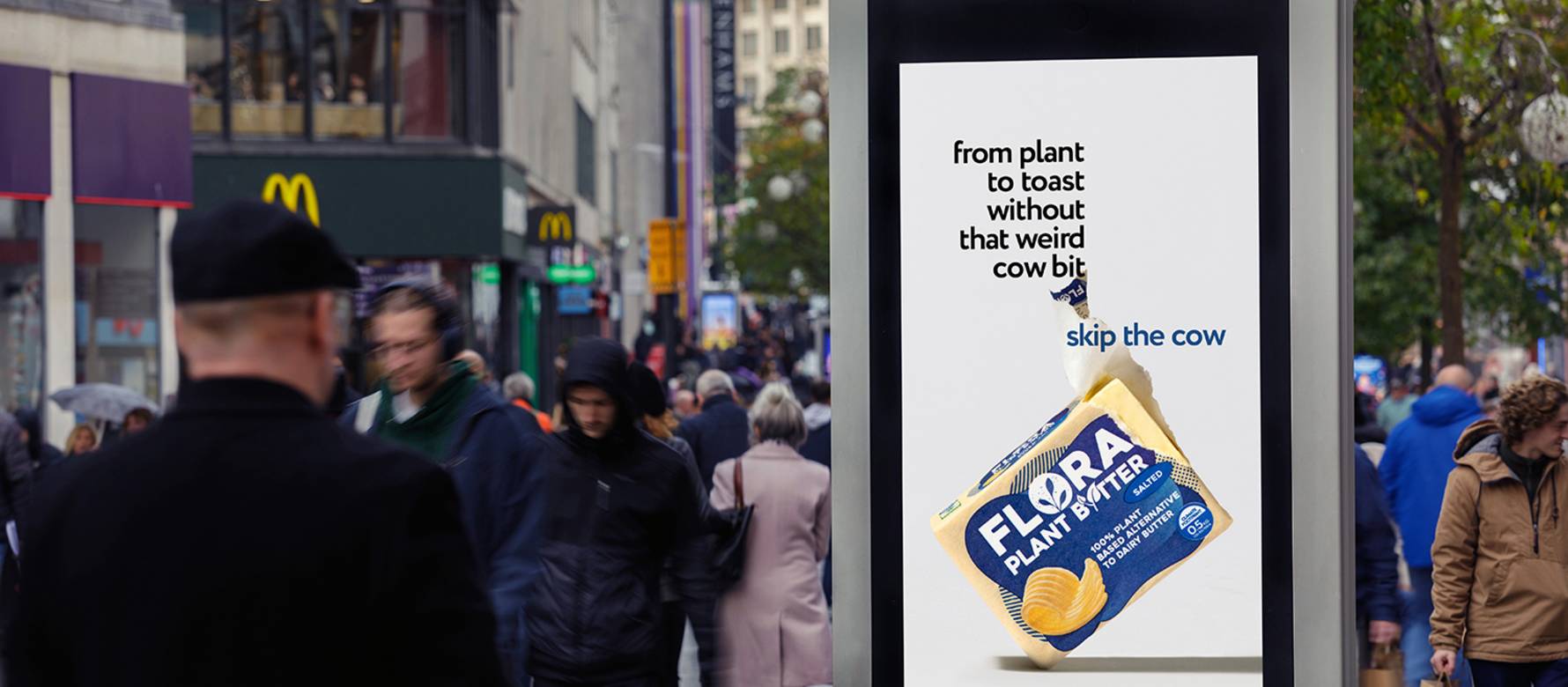 Flora plant butter advert on Adshel Live poster on high street