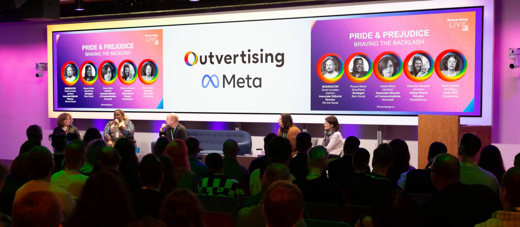 Outvertising Live 2023 panel speaking on stage in front of a large crowd