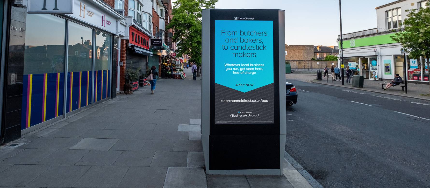 Adshel free-standing screen on empty street displays blue education image