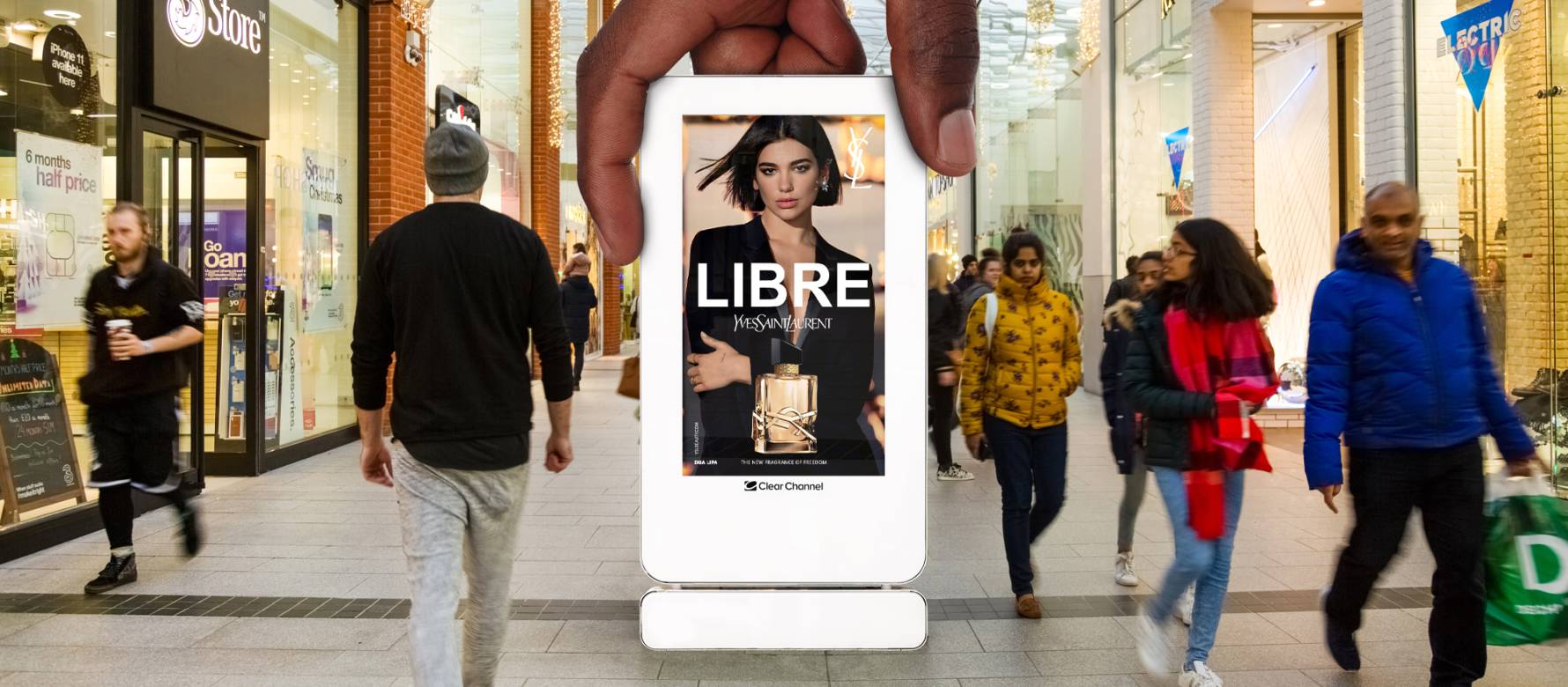 Digital screen in a shopping mall showing Yes Saint Laurent LIBRE advert