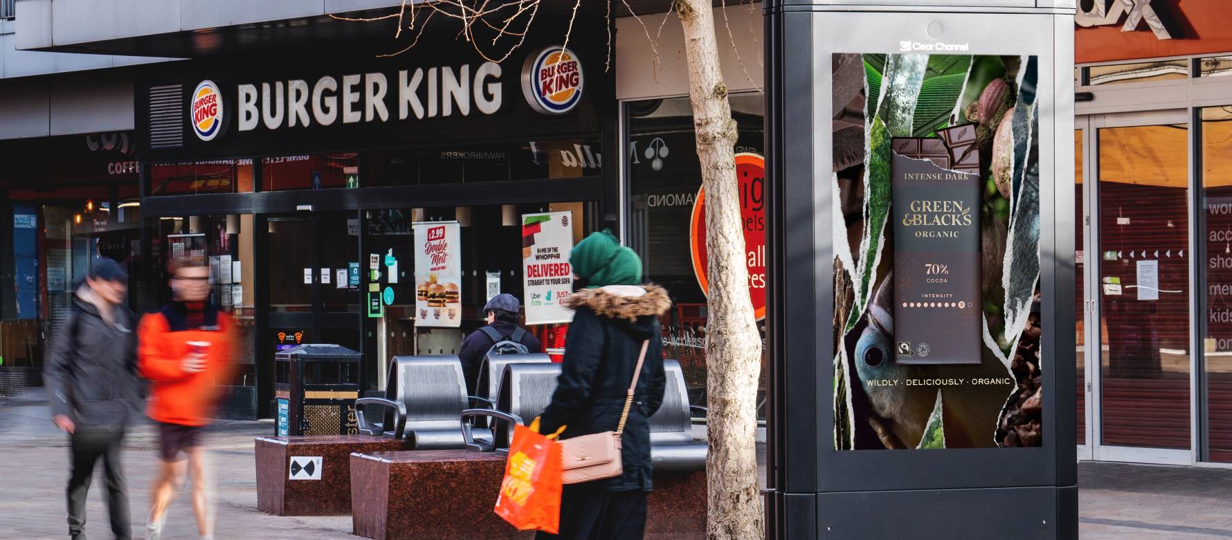 Digital screen outside Burger King showing Advert for Green & Black's