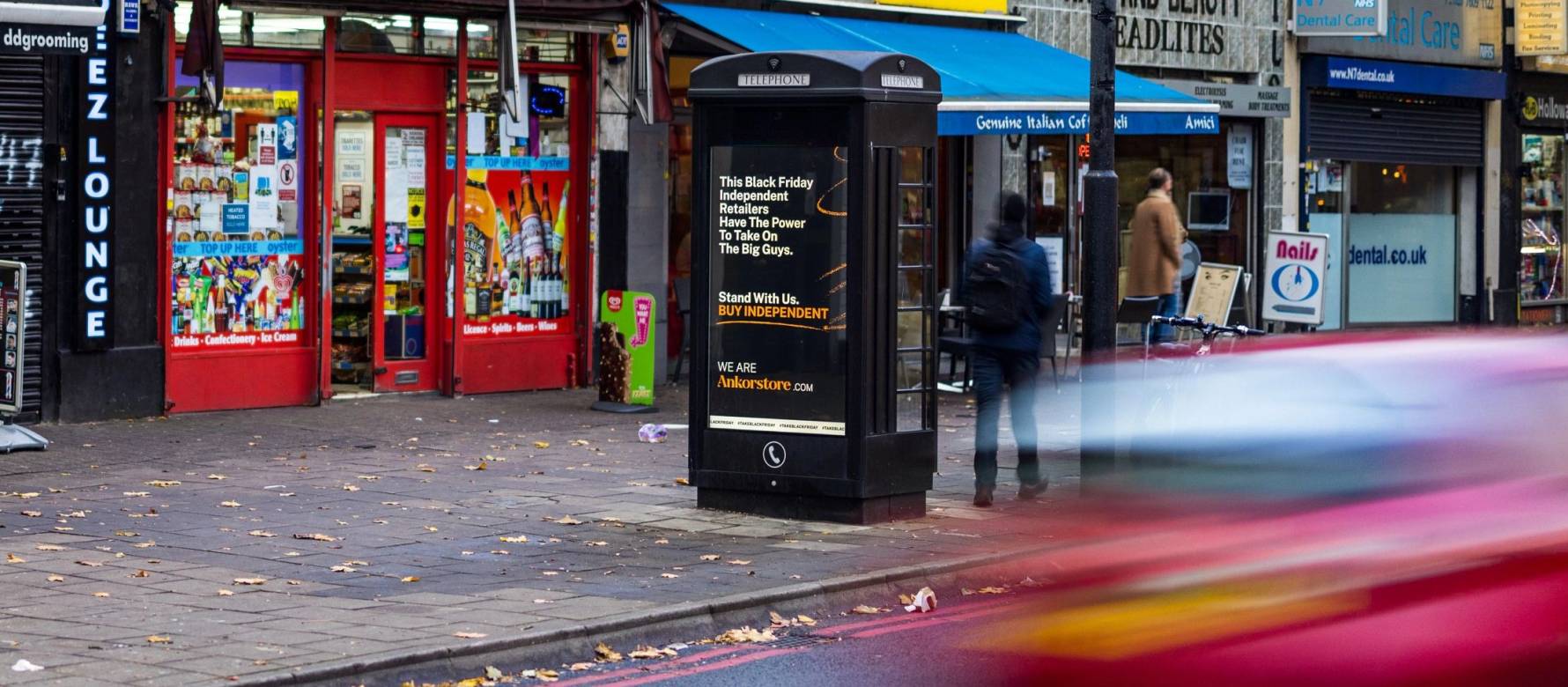 An ad for an independent retail website on Adshel Live screen on a roadside phone kiosk