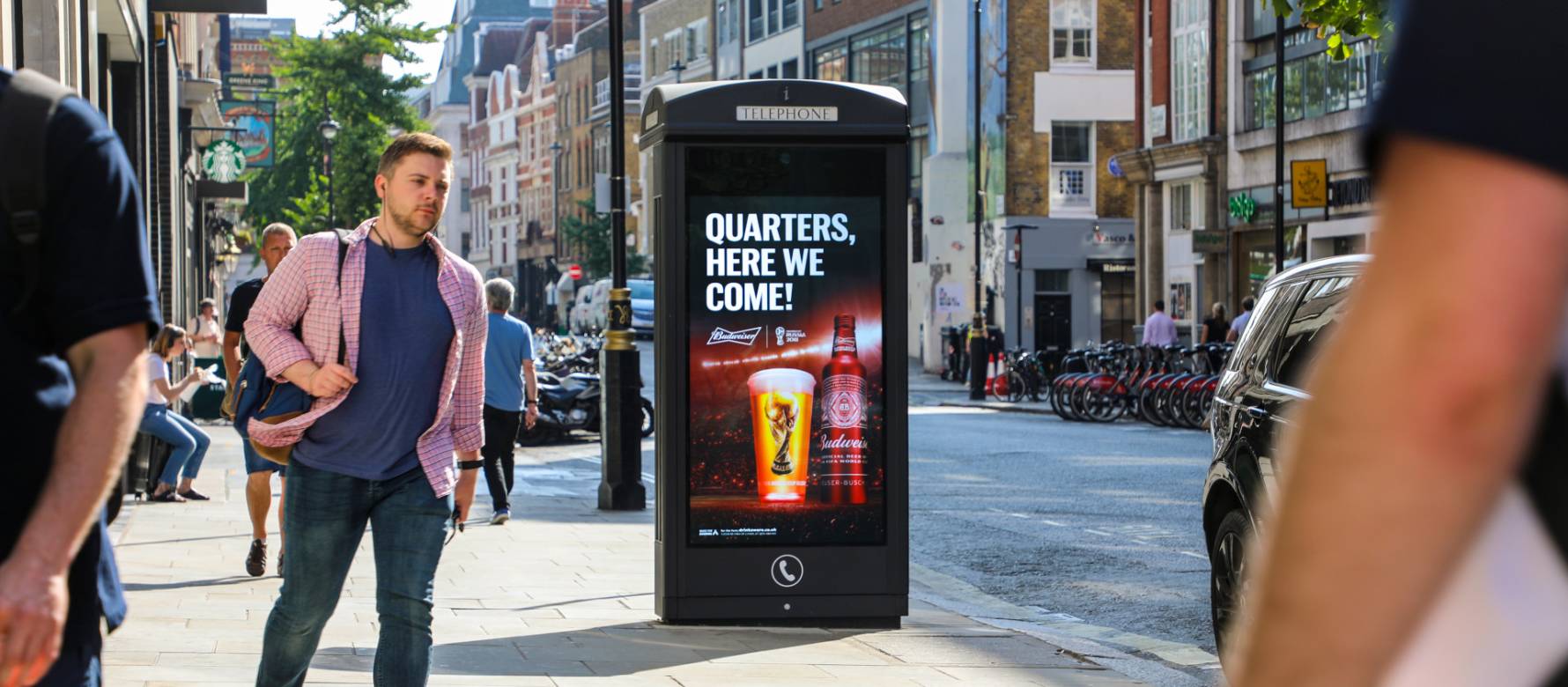 Adshel Live Phone box showing Budweiser advert