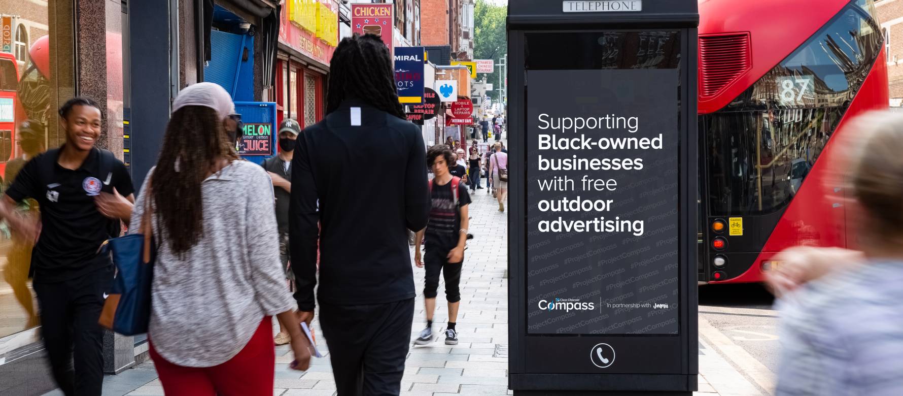 Adshel screen displays black image and text 'Supporting Black-owned businesses with free outdoor advertising.'