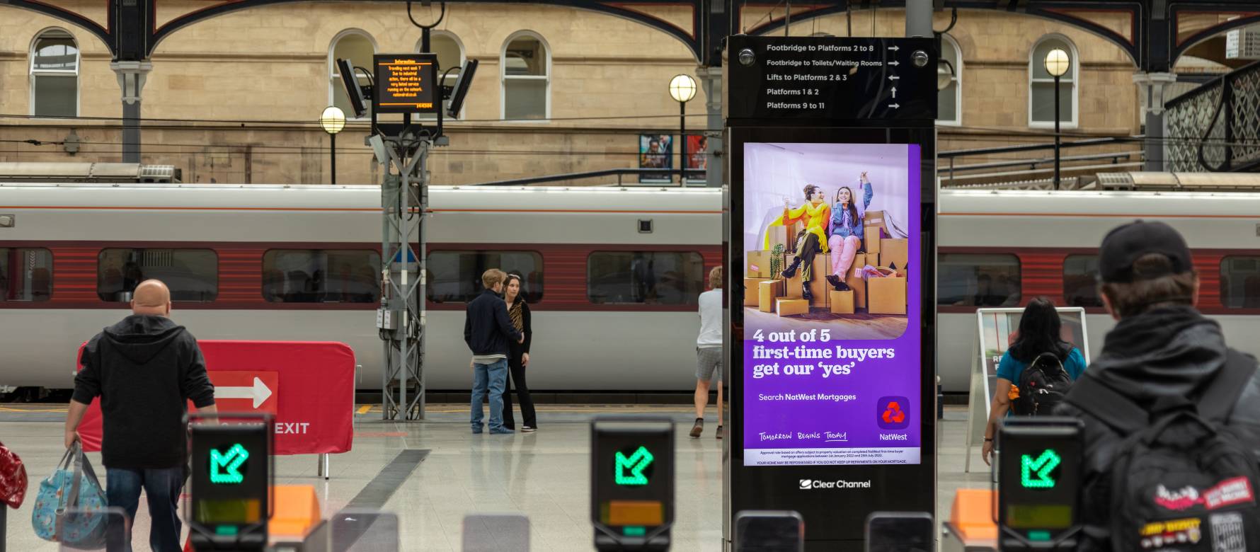 Adshel live adverting panel inside a train platform.