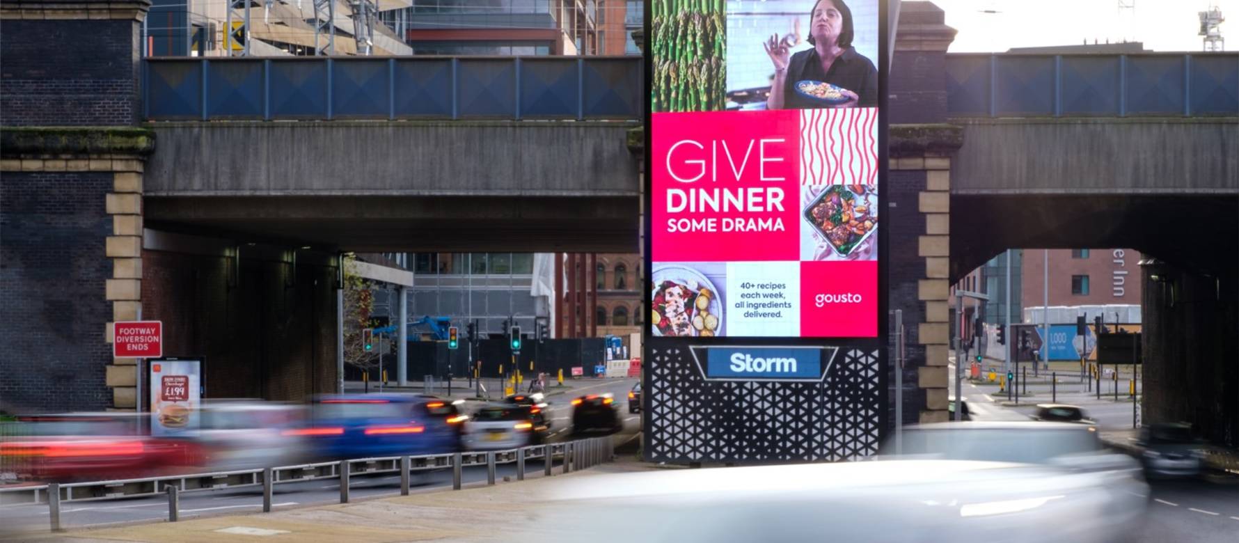 Clear Channel Storm site on a busy road showing advert for Gousto