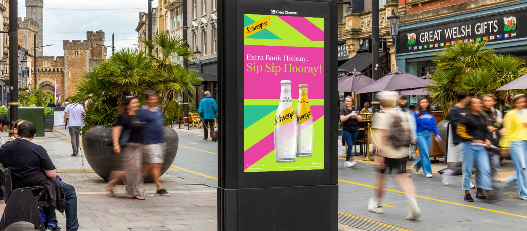 Schweppes advert on Adshel Live poster on high street