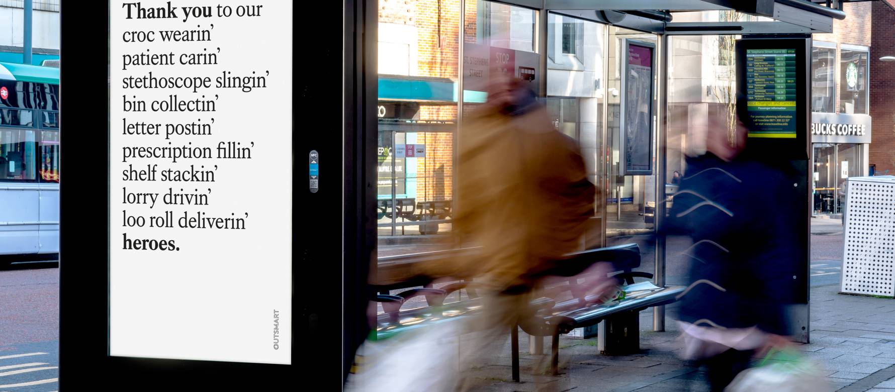 Adshel live screen on bus stop showing Outsmart advert