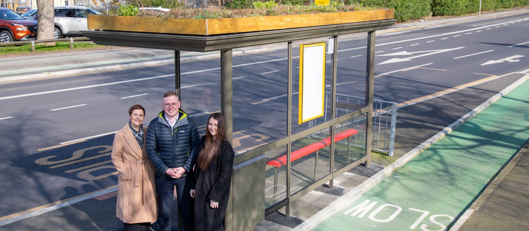 Clear Channel UK's Emma Lloyd and Jennifer Richards standing next to Preston's first Living Roof bus shelter with Lancashire's Councilor Scott Smith