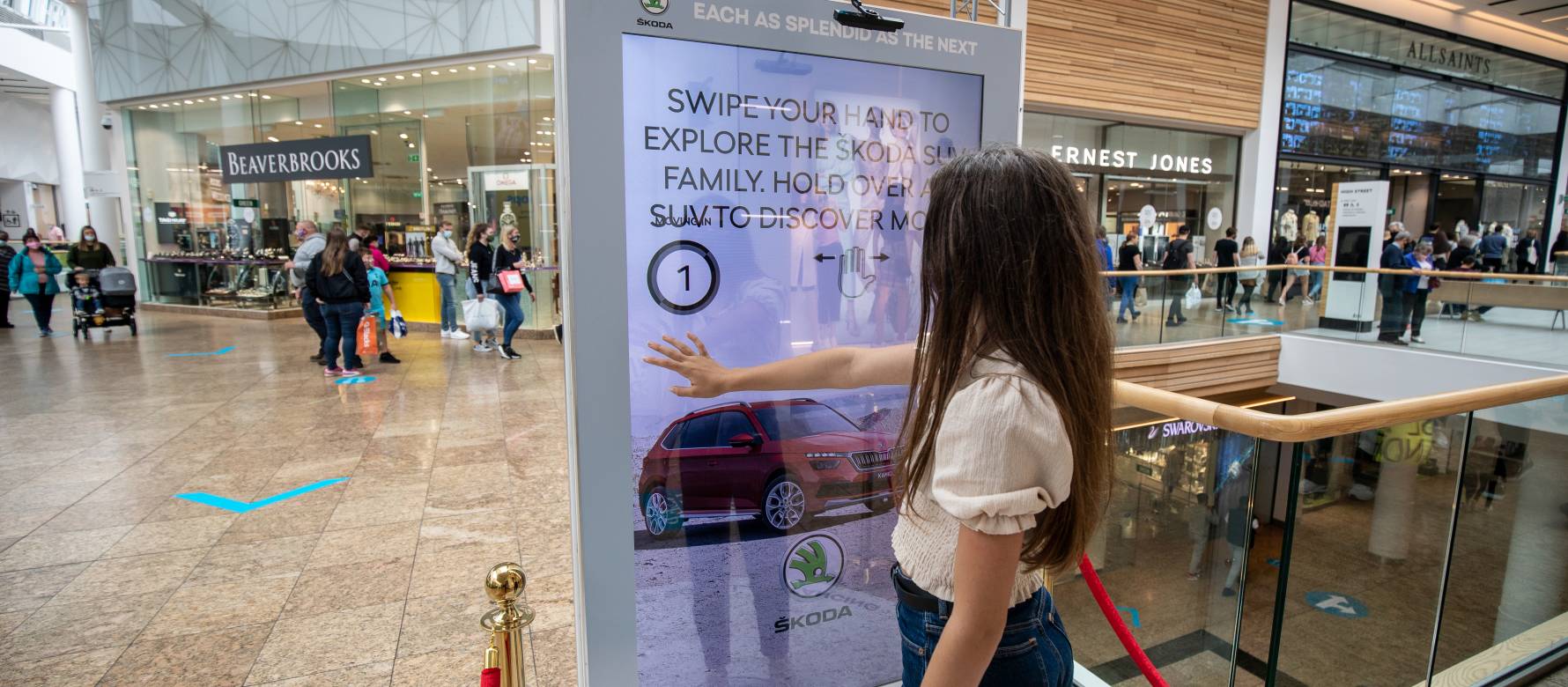 Digital screen in a shopping mall showing Skoda advert