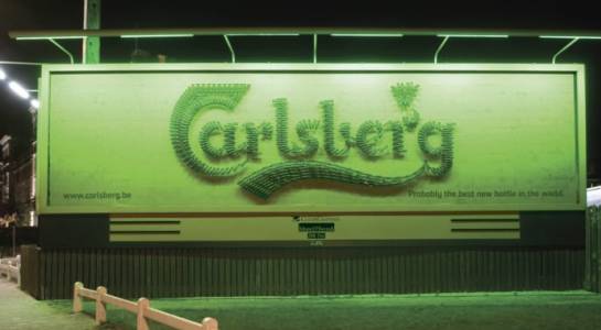 A Carlsberg ad on a Clear Channel billboard with illumination in 2002