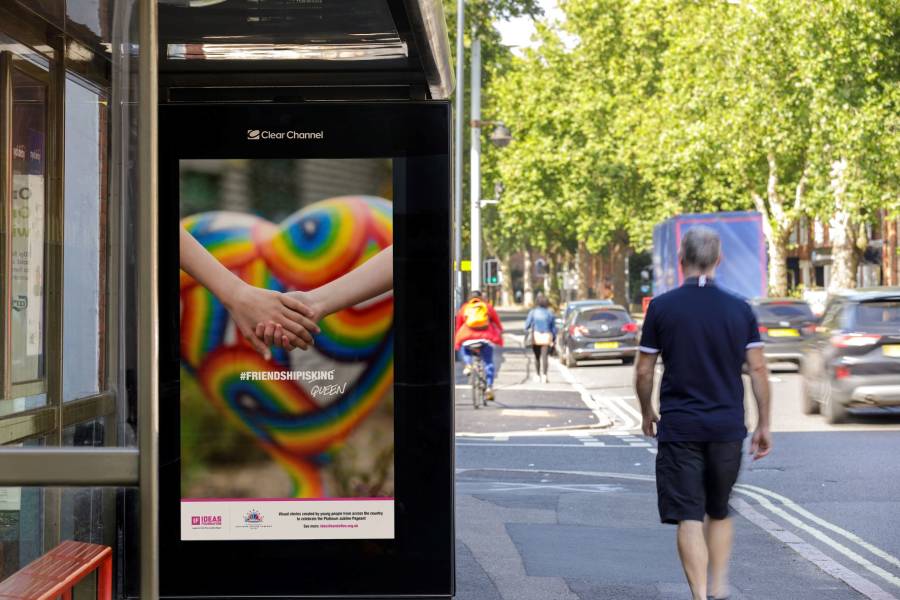 Digital screen on a bus stop showing Ideas Foundation ad