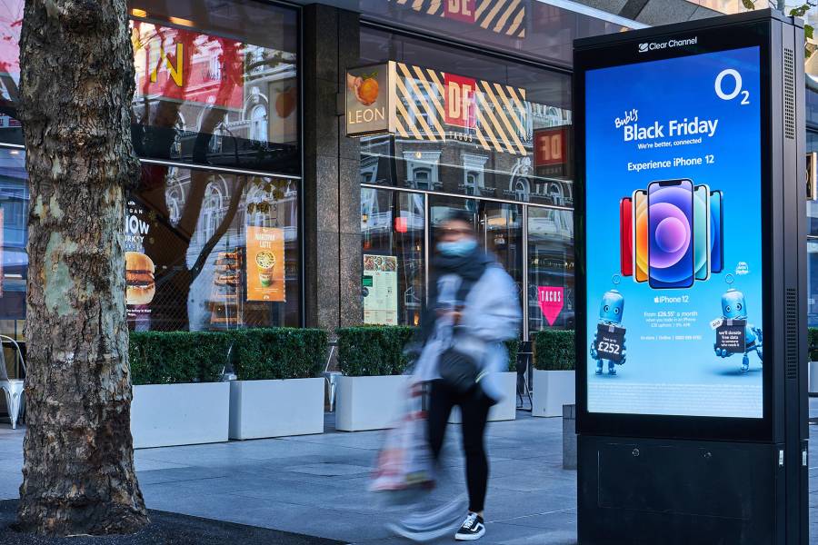 O2 Black Friday advertisement on Adshel Live outside a Leon on Tottenham Court Road