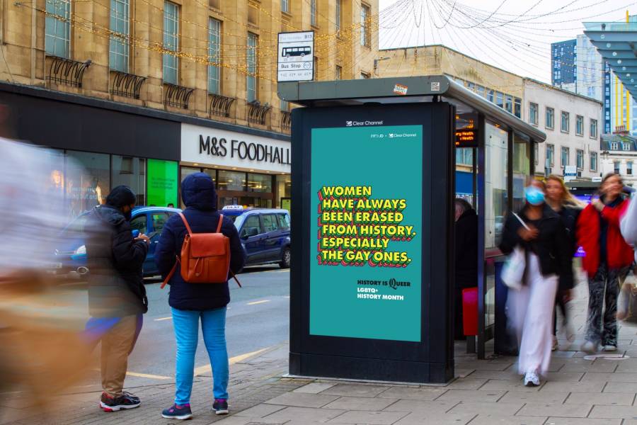 Adshel Live screen on busy high street opposite M&S showing Clear Channel & Ogilvy campaign for LGBTQ+ History Month