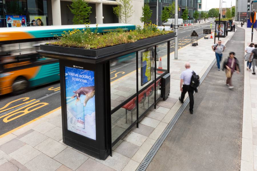 Evian advert on a Adshel Live poster at a bus stop