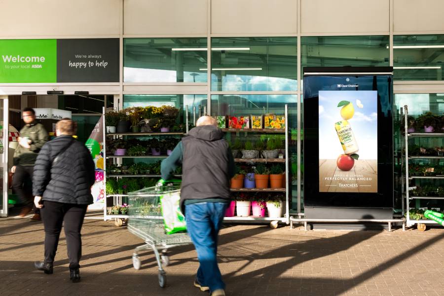 An advertising screen in ASDA supermarket with a Thatchers ad