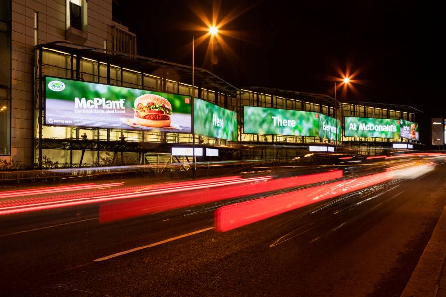 Mcdonalds advert on huge Cromination poster on main road