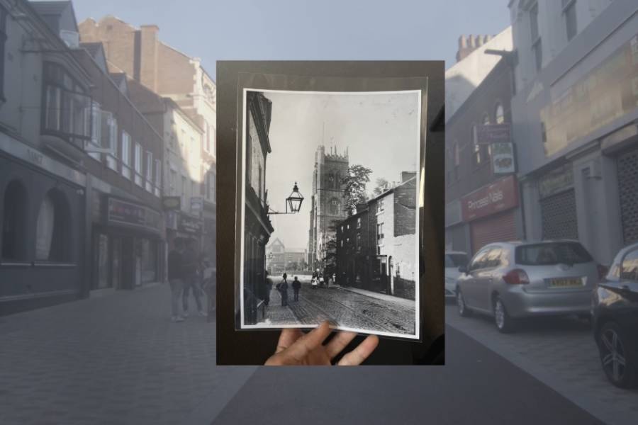 Photo of a high street with an old image.