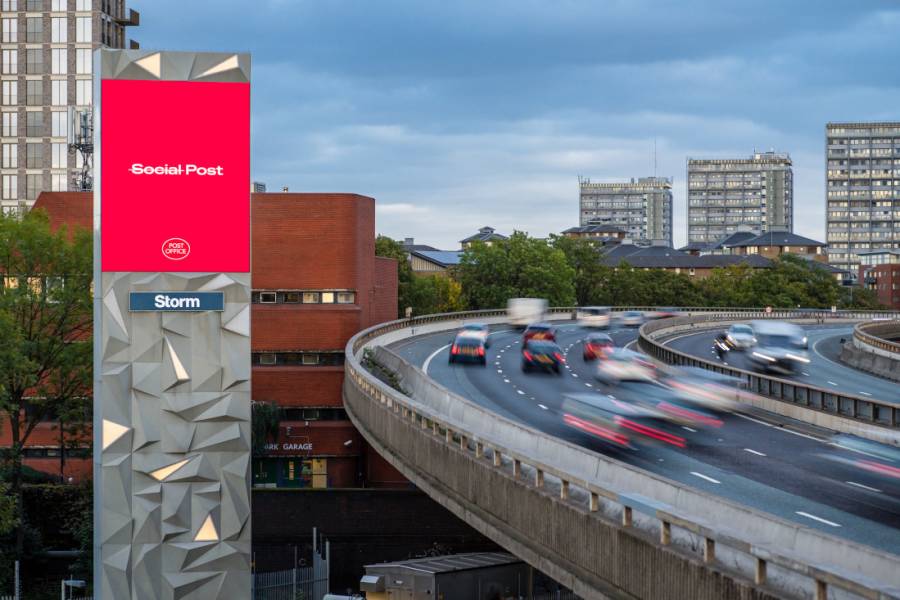 post office advert on Storm poster by busy road