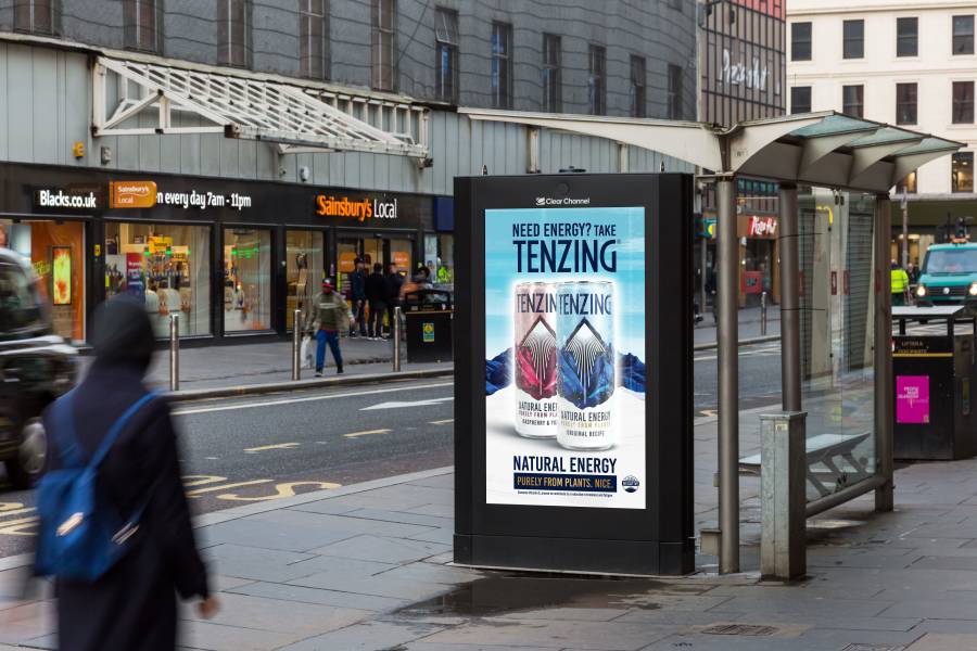 Digital screen opposite Sainsbury store showing Tenzing Natural Energy drink.