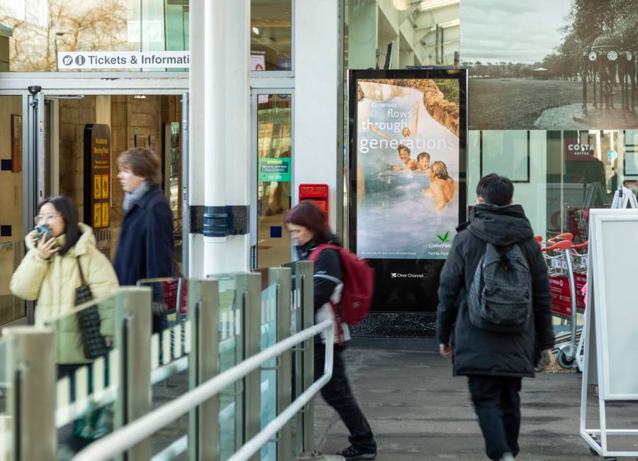 Centreparcs ad with people walking past