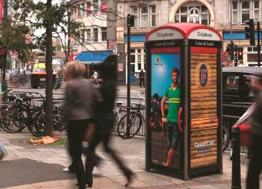 Phone box showing ad for Fosters