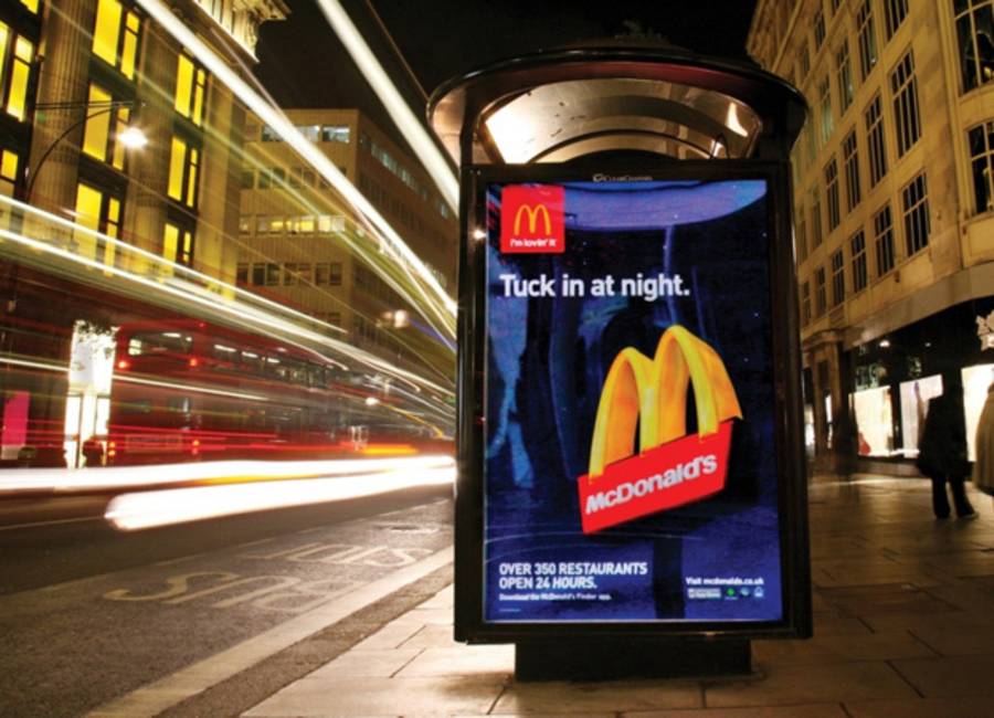 Billboard on a bus stop showing ad for Mcdonalds