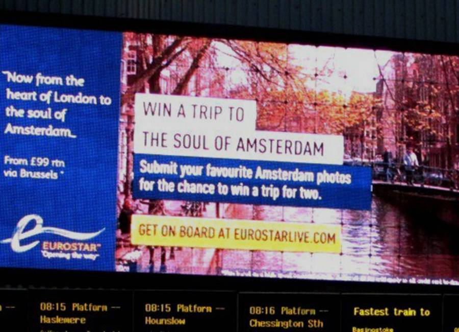 Large billboard at rail station showing Eurostar ad