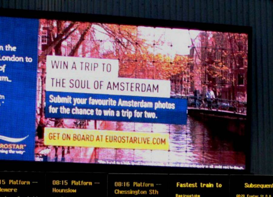 Large billboard at rail station showing Eurostar ad