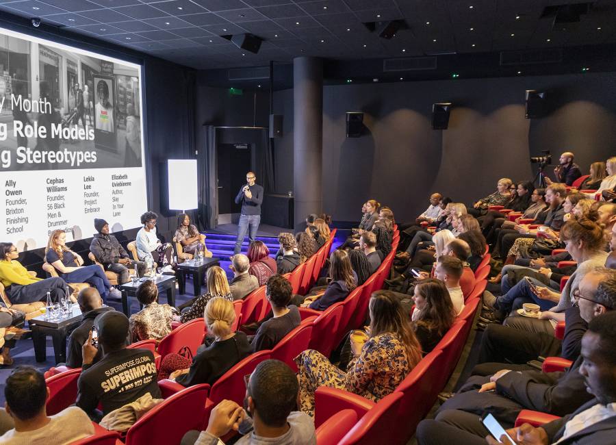 Clear Channel Managing Director, Richard Bon, speaks during a Black History Month presentation to an auditorium of listeners