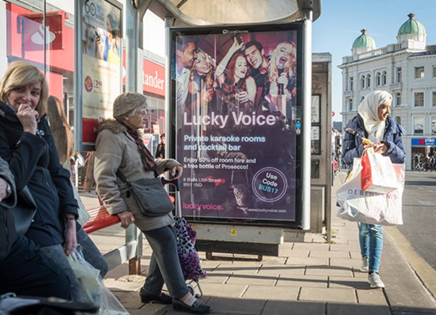 A local Karaoke advert on an Adshel Live panel