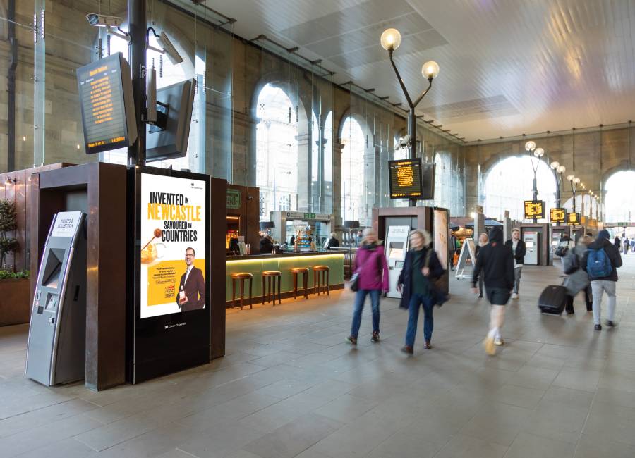 Our station live screens inside a train station.