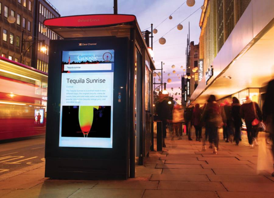 Digital screen on a bus stop outside John Lewis showing Google ad