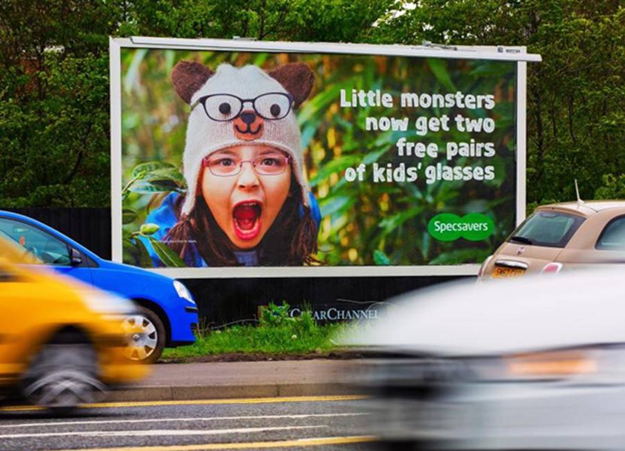 Large billboard showing ad for Specsavers