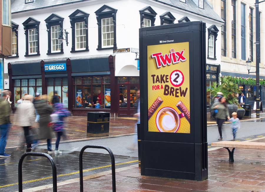 Twix digital poster on a wet high street with the copy 
