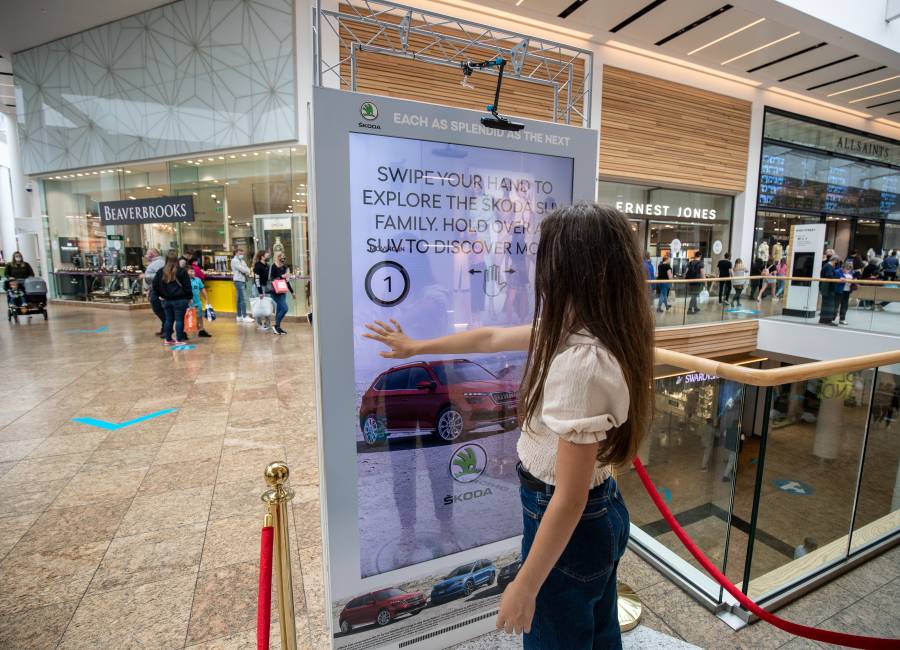 Digital screen in a shopping mall showing Skoda advert