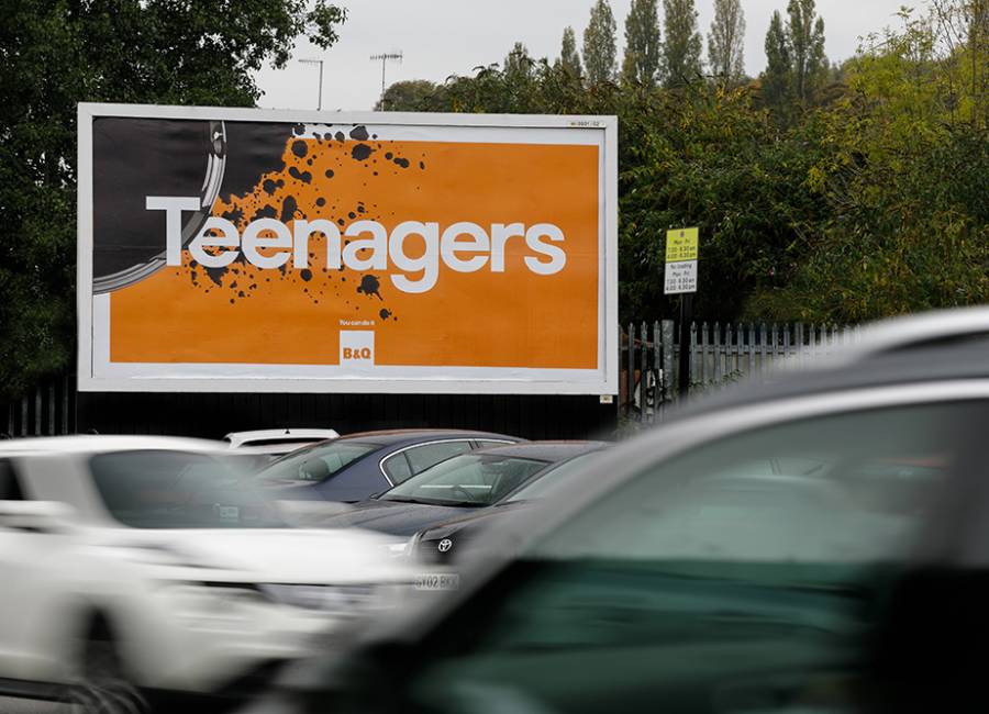 B&Q billboard poster site saying Teenagers with a tin of black paint