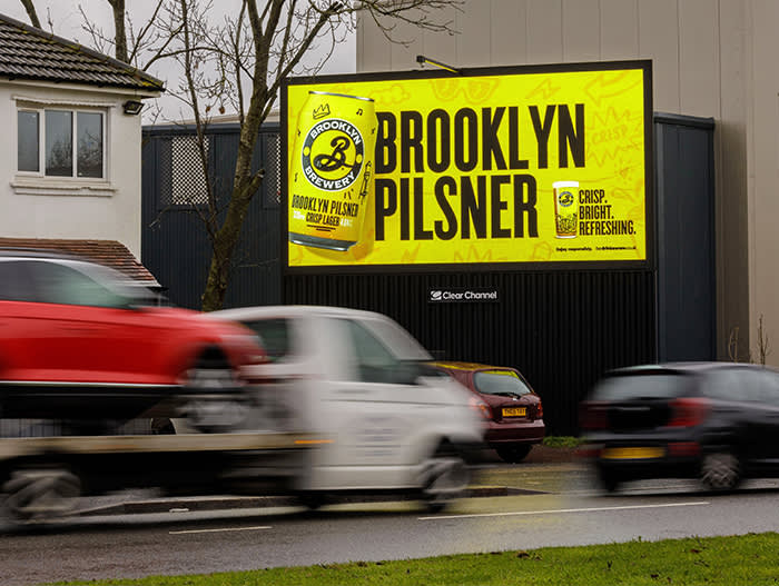 Brooklyn Pilsner digital billboard with cars driving past