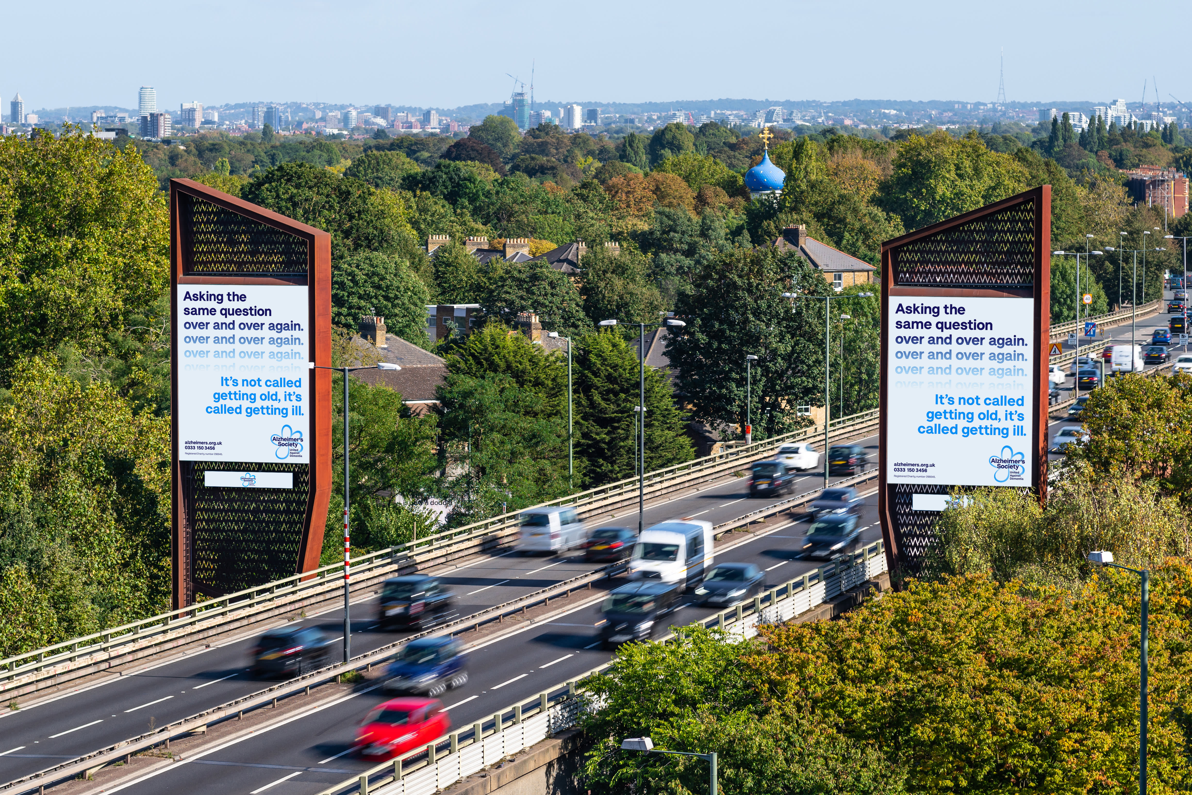 Clear channel Storm site on a busy main road showing ad for Alzheimer's society