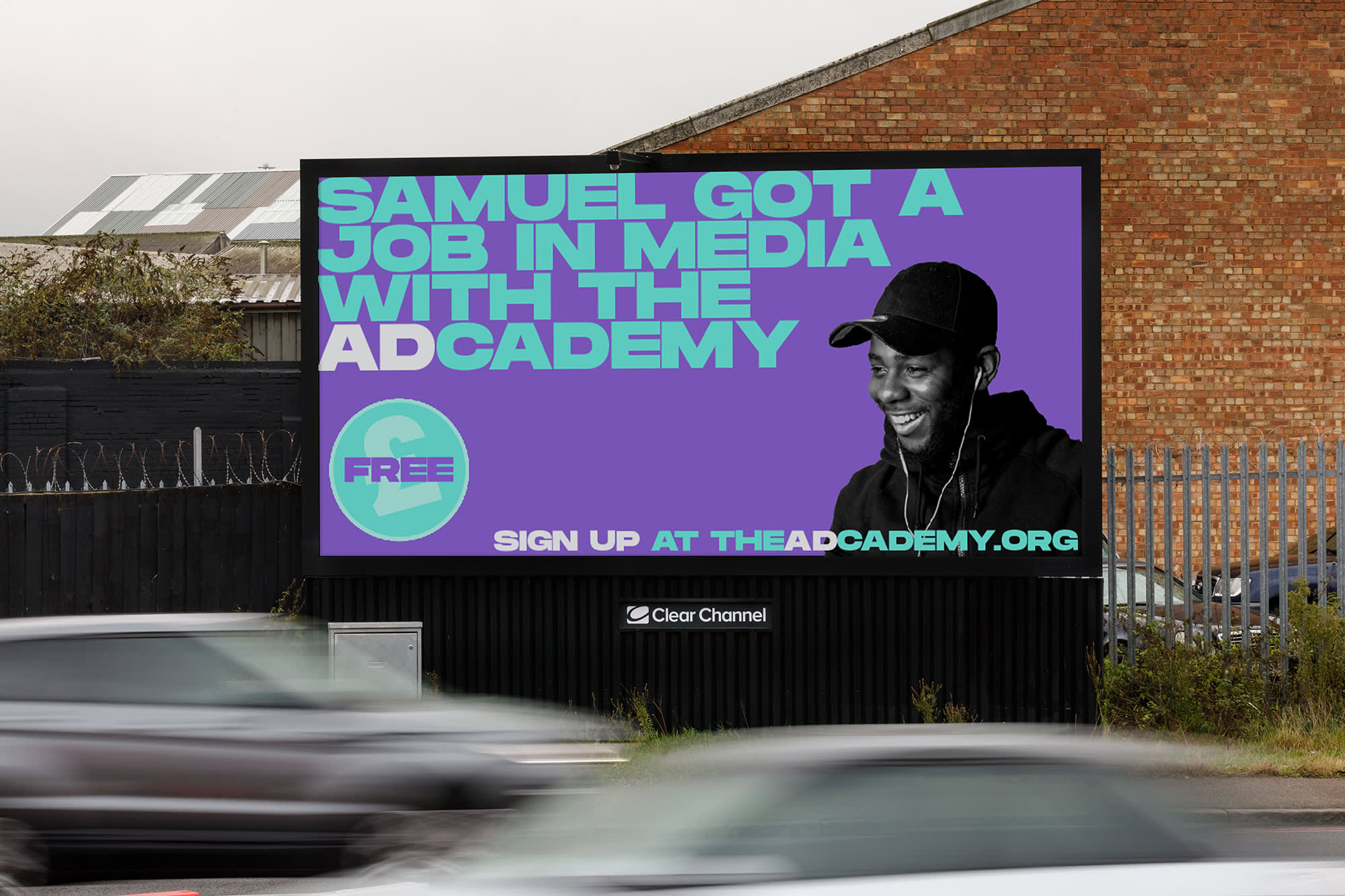 A large billboard with a person on it, promoting how you can get a job in media.