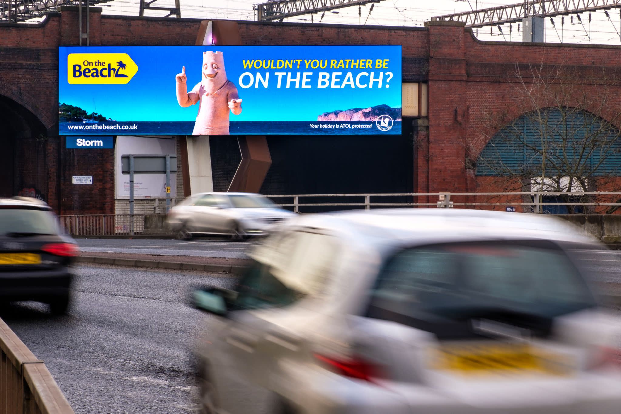 On the Beach roadside billboard ad