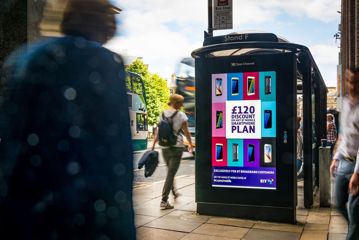 Bus stop with a digital screen showing a BT ad